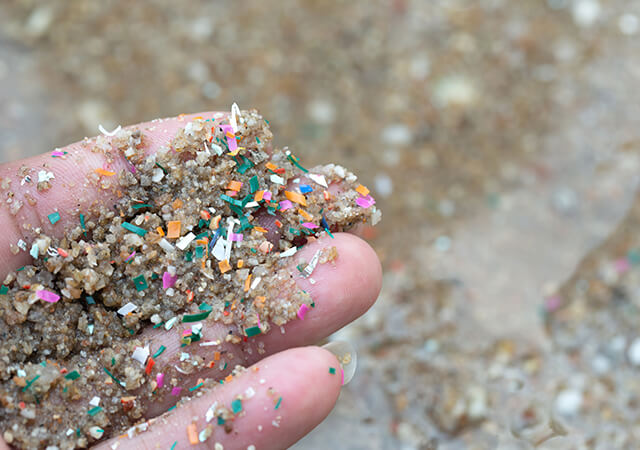 Microplastic waste contaminated with seaside sand